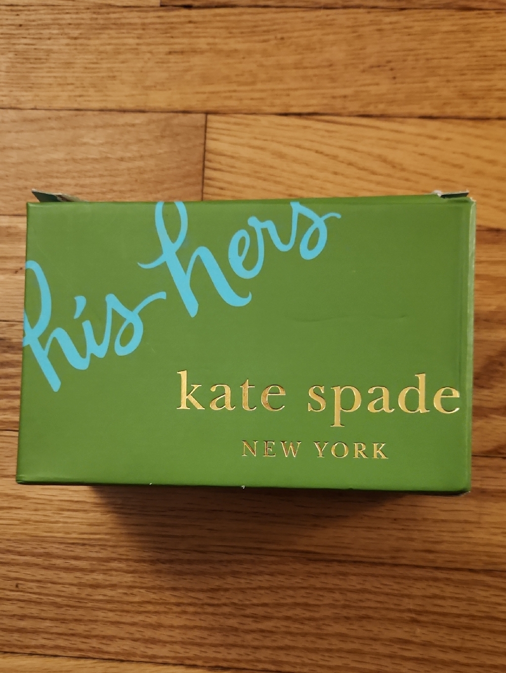kate spade green box with blue script and gold logo